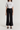 Black straight pants with circular pocket detail
