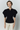 Black cotton sculptural top with puffed sleeves