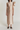 Nude satin midi dress with asymmetric ruffle detail